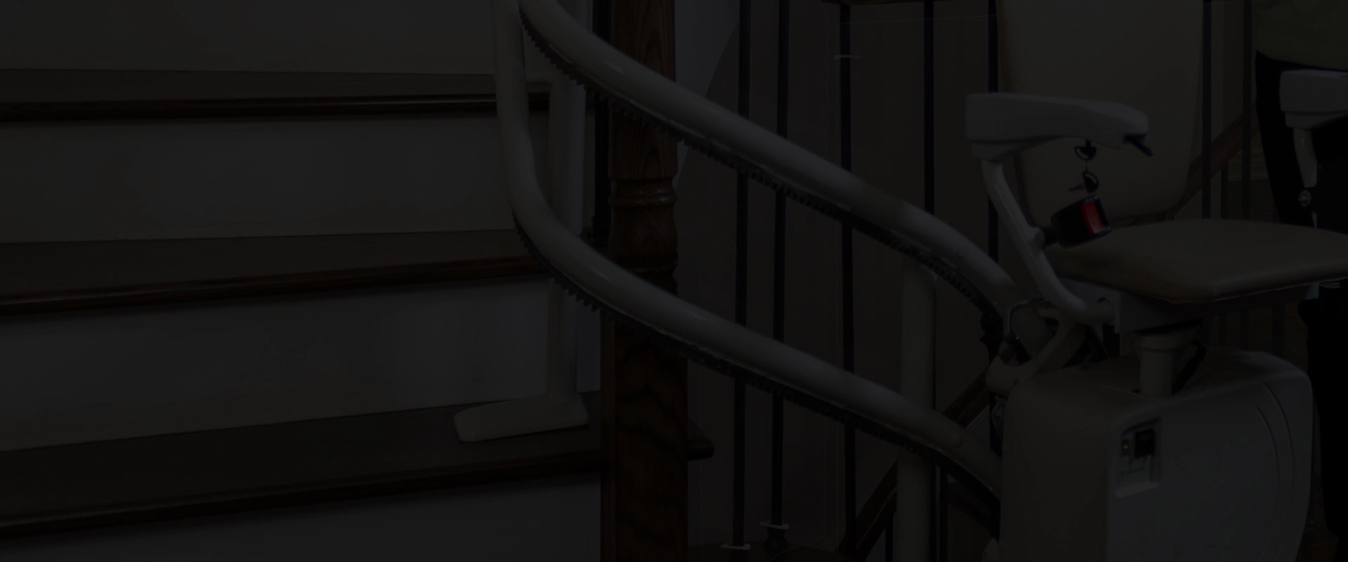 Handicare curved stair lift on a winding staircase