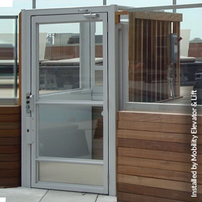 Vertical platform lift providing accessibility to the upper level of a patio.