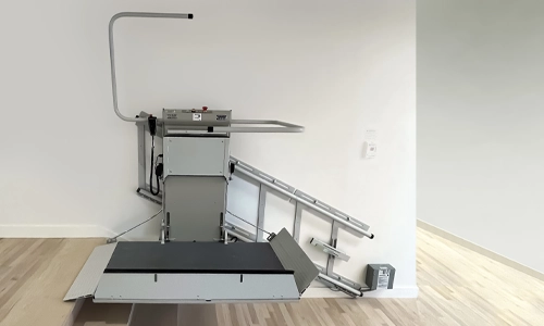 A Savaria Delta inclined platform lift installed over a small set of stairs.
