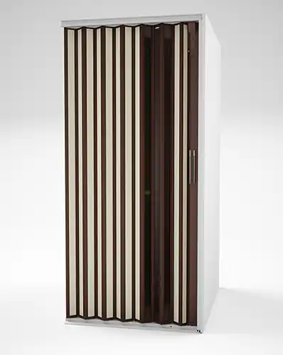 A residential home elevator showcasing bronze framing and antique white inserts for its accordion gate.